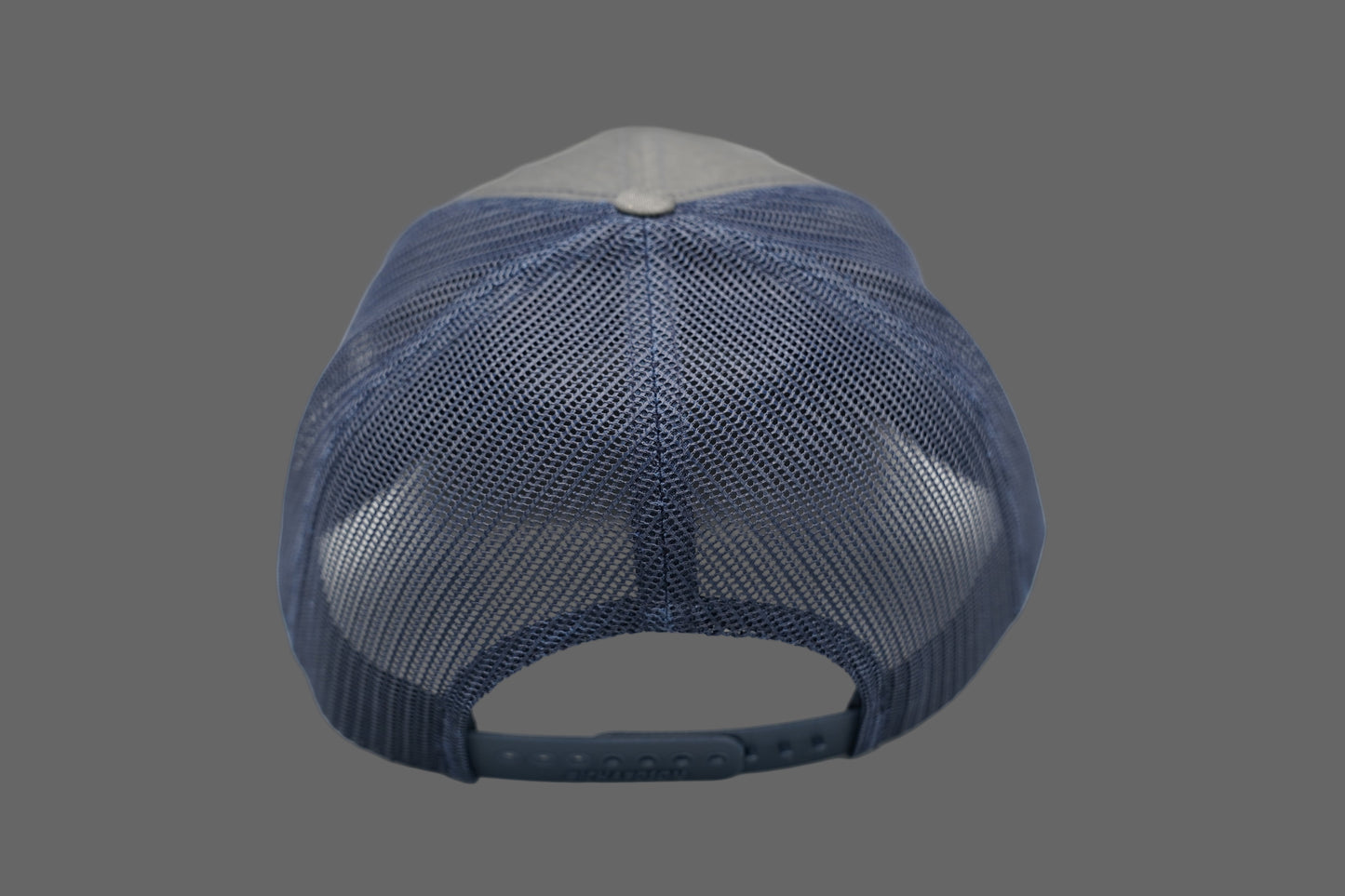 Blue mesh cap on a gray background