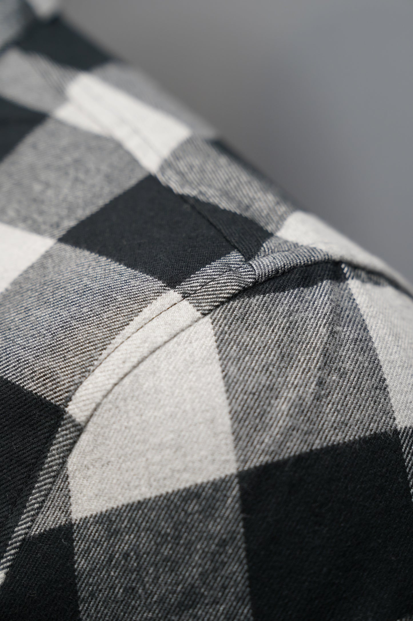 Close-up of black and white checkered fabric texture