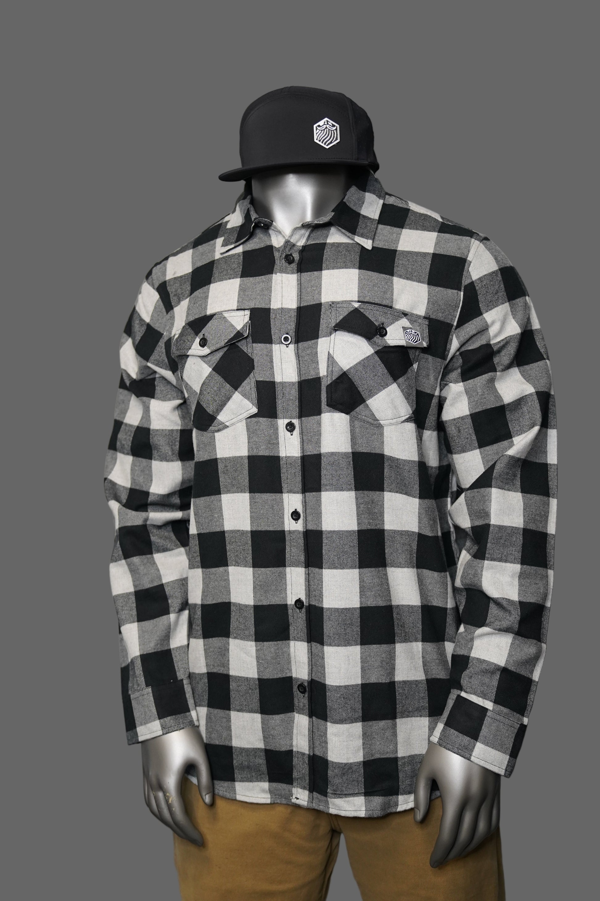 Black and white checkered shirt against a gray background