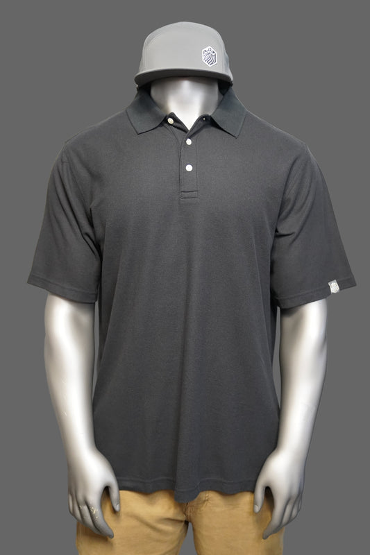 Black polo shirt against a gray background