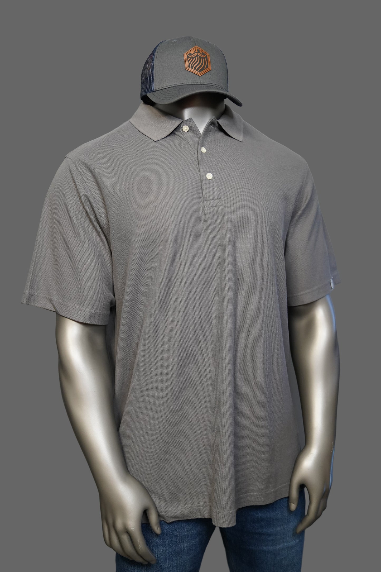 Graphite polo shirt with logo on a plain background