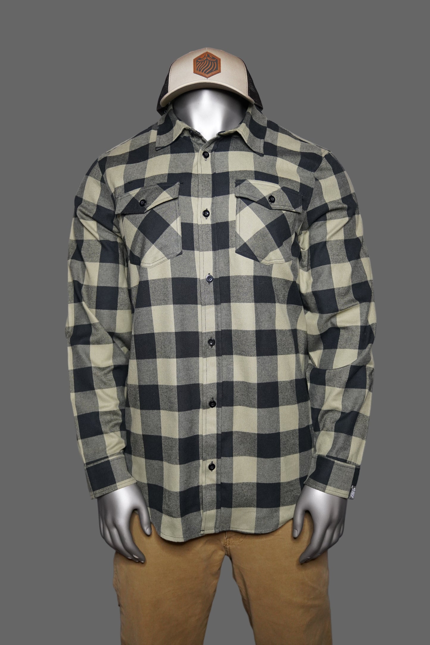 Black and olive checkered shirt against a gray background