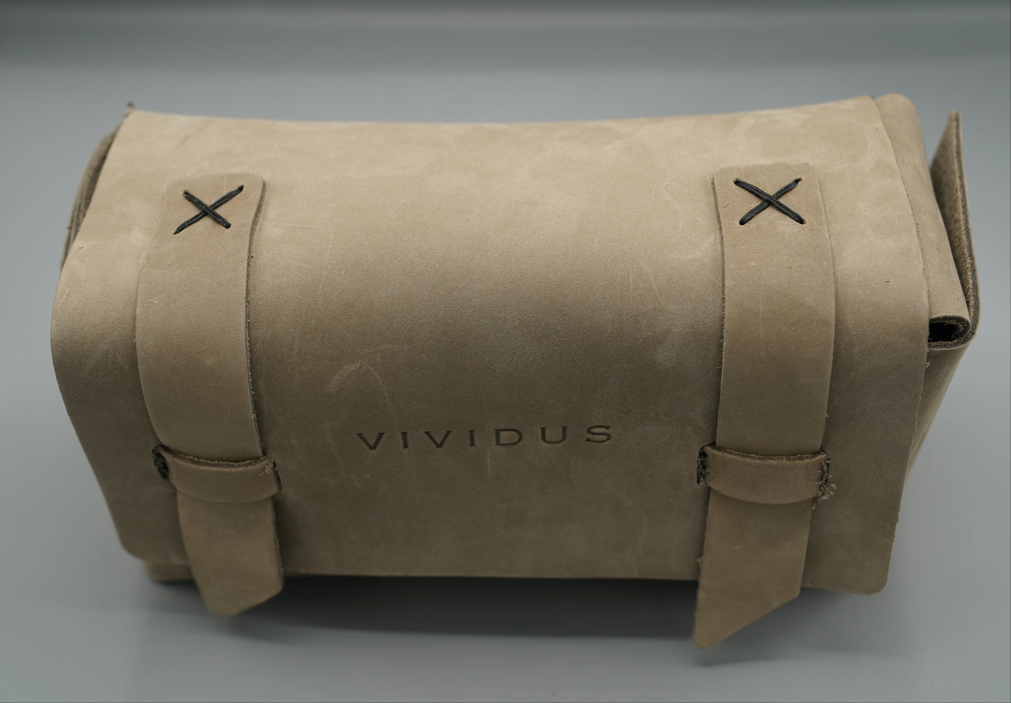 Leather Dopp Kit Bag roll-up bag with 'VIVIDUS' branding on a gray background