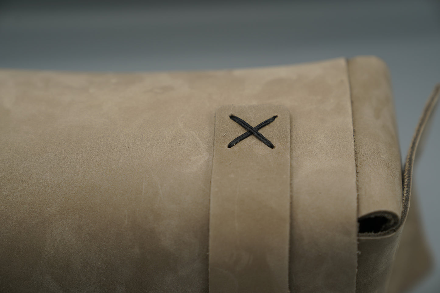 Leather Dopp Kit Bag roll-up bag with 'VIVIDUS' branding on a gray background