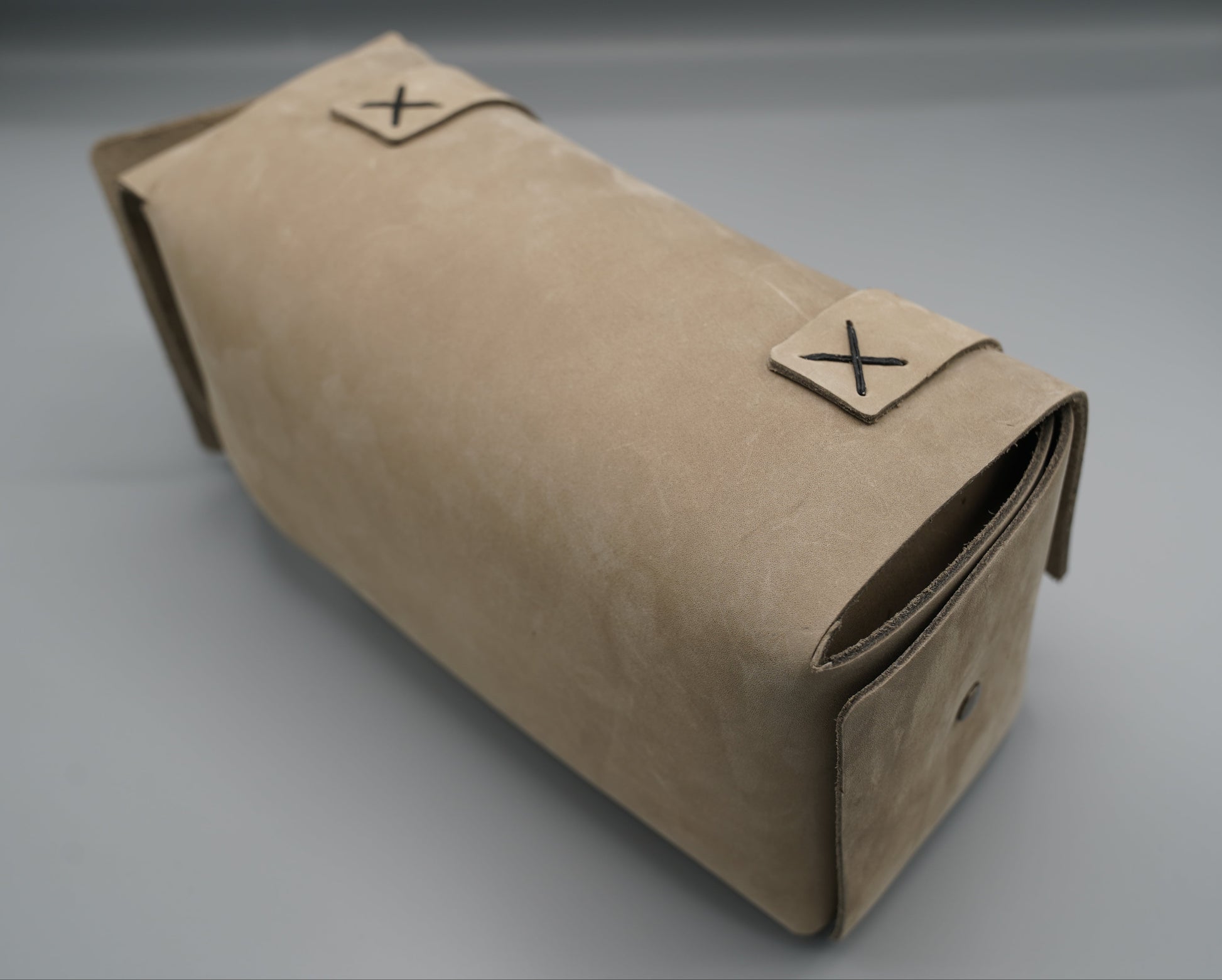 Leather Dopp Kit Bag roll-up bag with 'VIVIDUS' branding on a gray background
