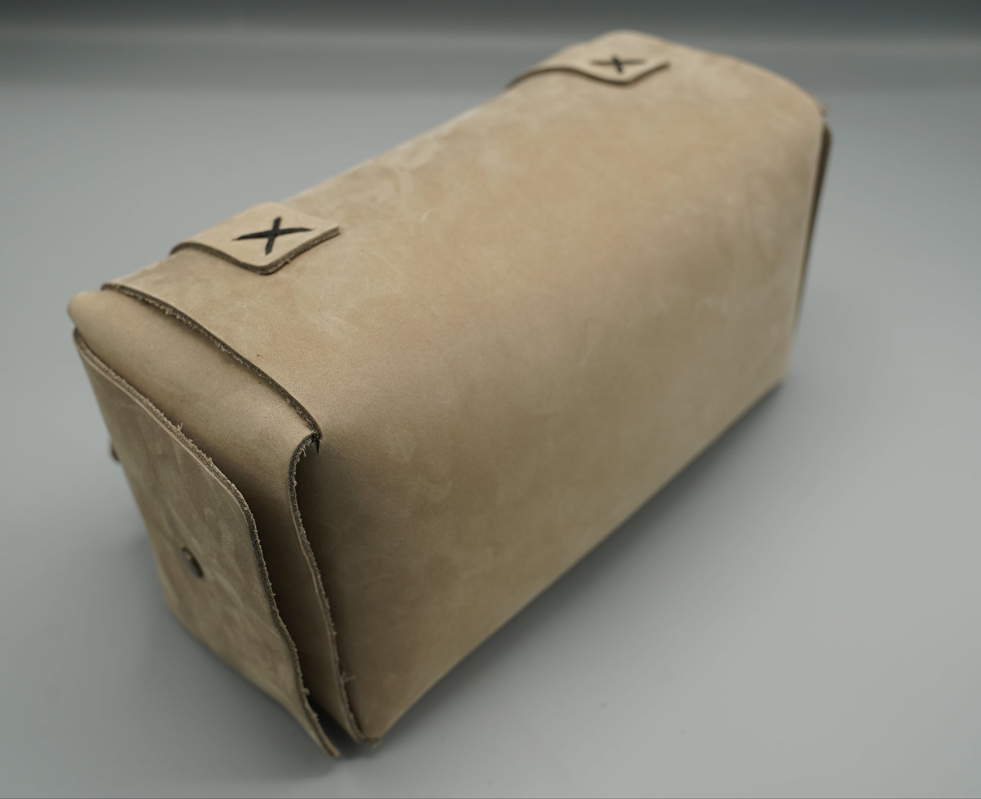 Leather Dopp Kit Bag roll-up bag with 'VIVIDUS' branding on a gray background