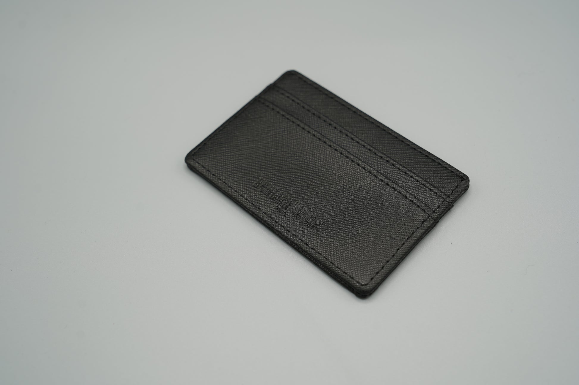 Elegant genuine diamond-textured leather RFID VIVIDUS debossed card holder
